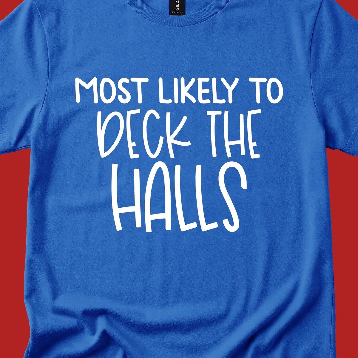 Text design 'Most Likely To Deck The Halls' in white lettering.
