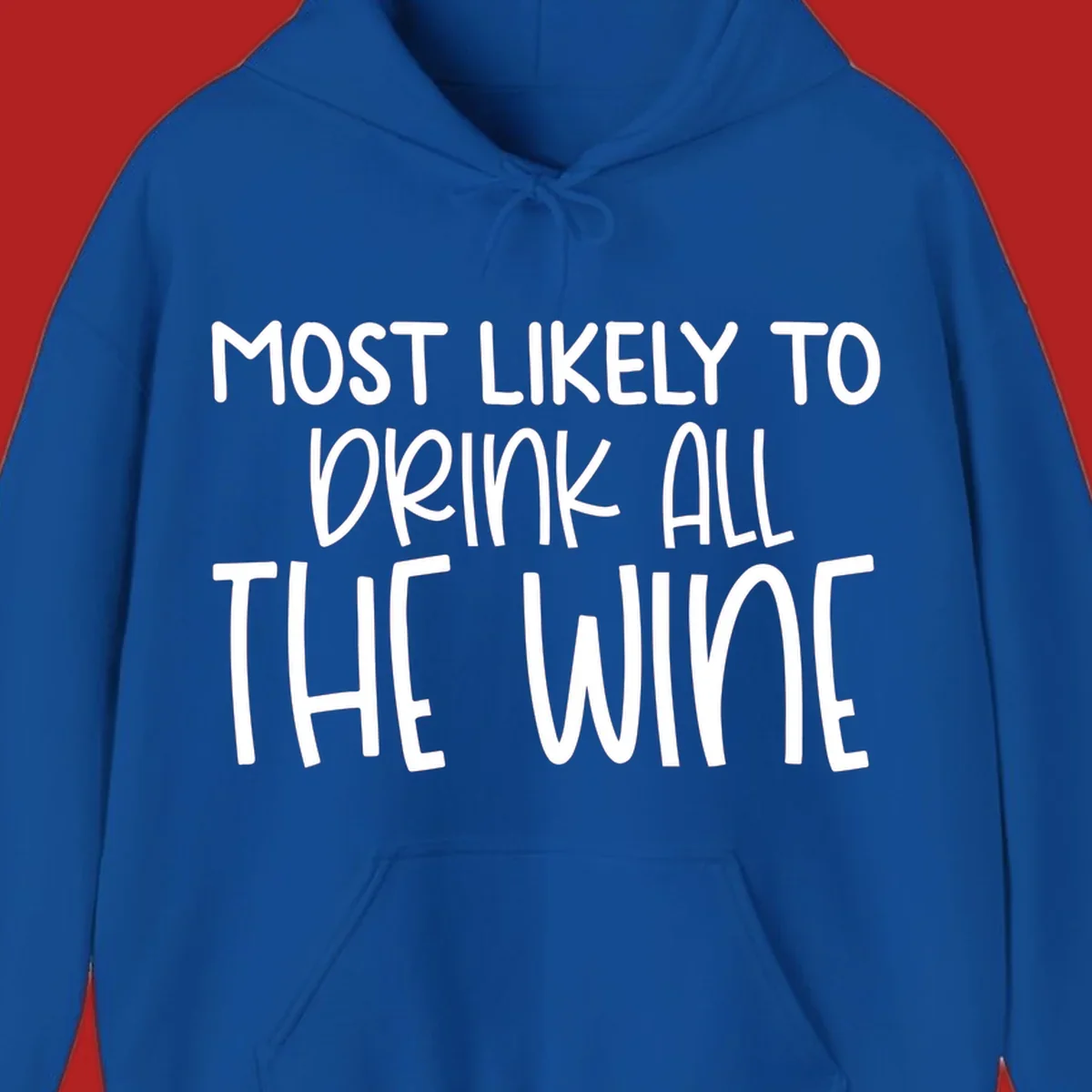 Text design 'MOST LIKELY TO DRINK ALL THE WINE' in white lettering.