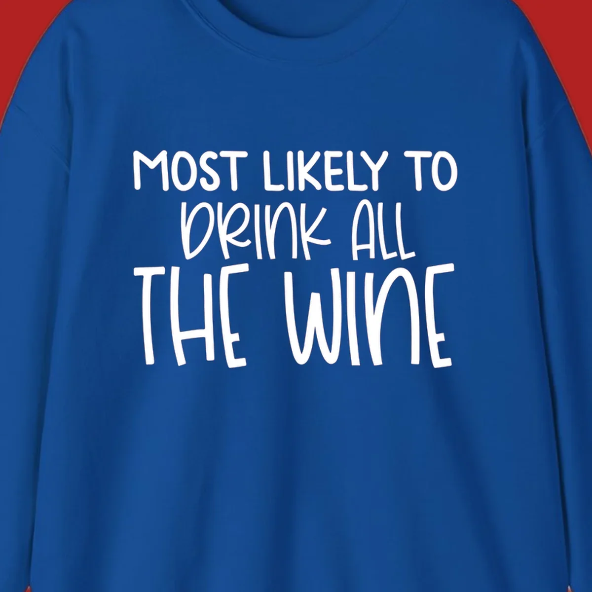 Text design 'MOST LIKELY TO DRINK ALL THE WINE' in white lettering.