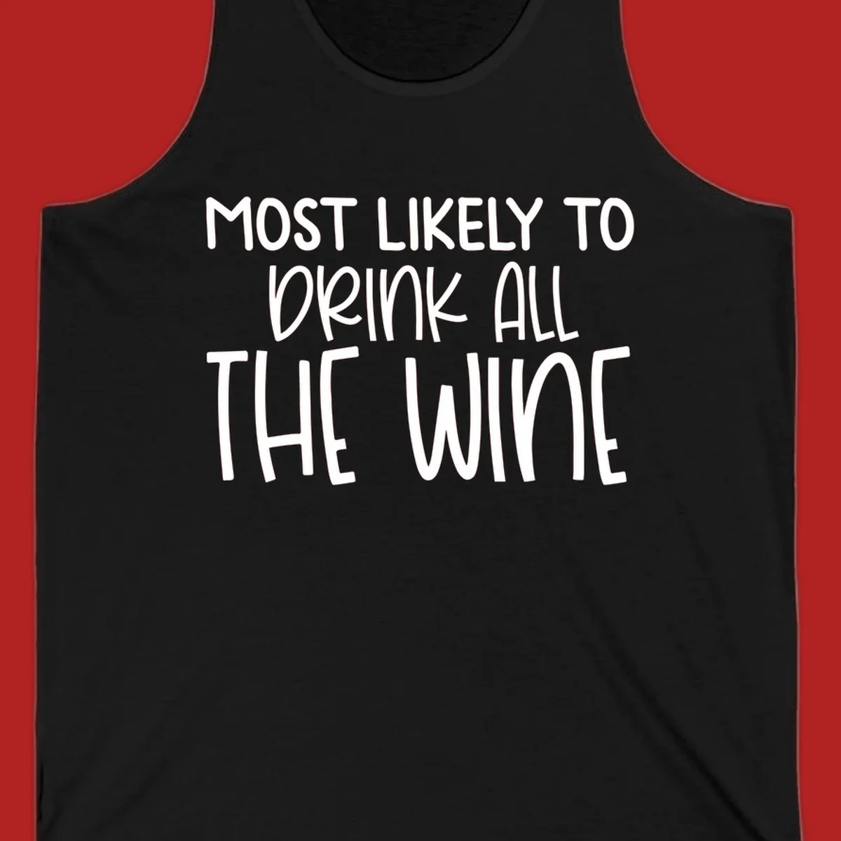 Text design 'MOST LIKELY TO DRINK ALL THE WINE' in white lettering.