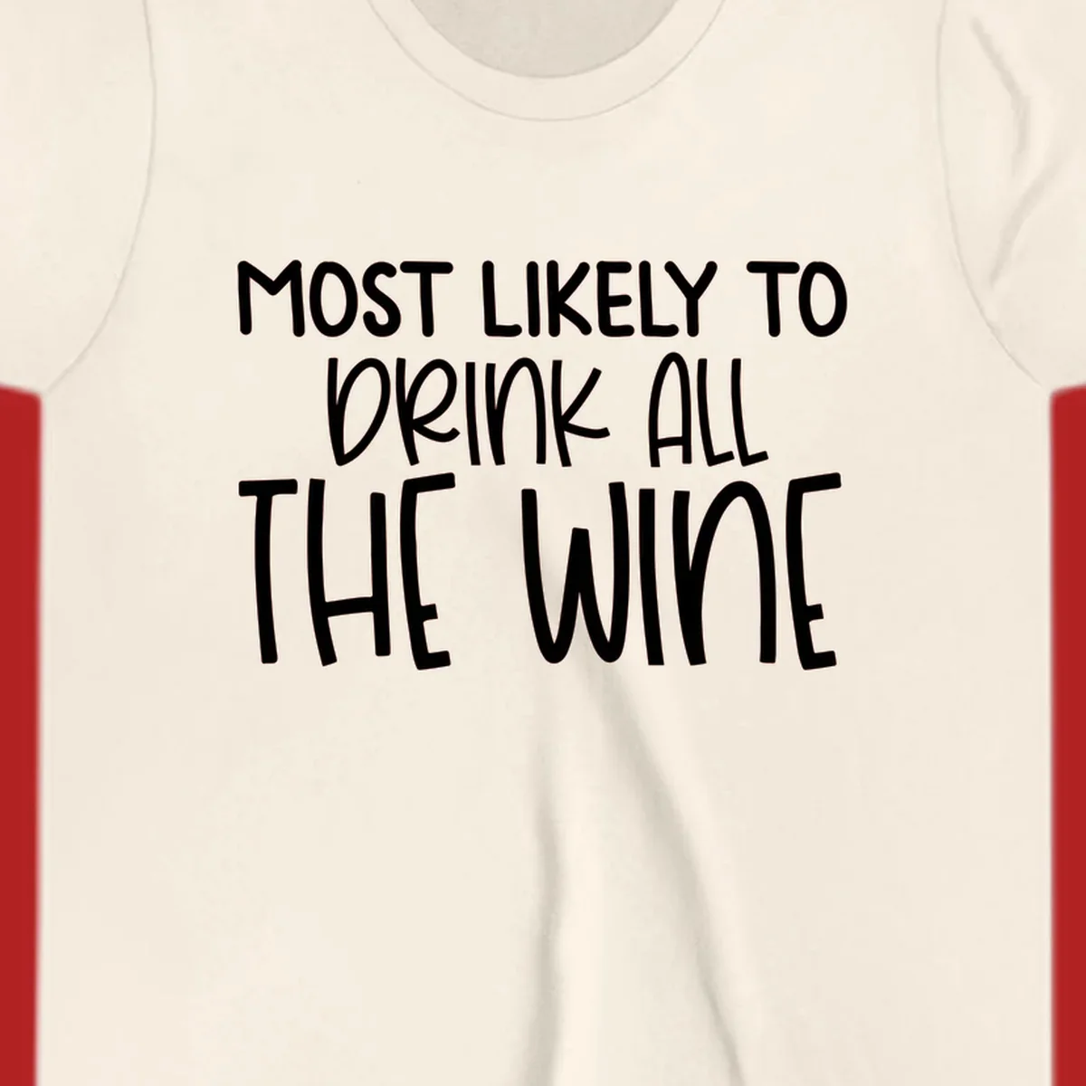 Text design 'MOST LIKELY TO DRINK ALL THE WINE' in white lettering.