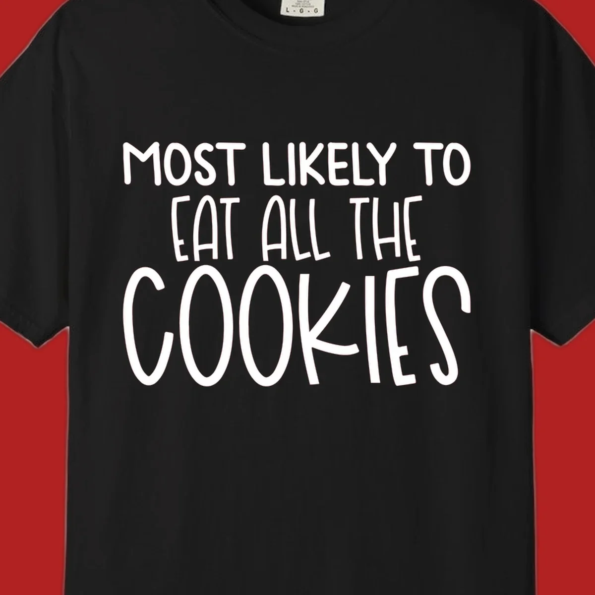 White text 'Most Likely To Eat All The Cookies' on a black background. typography