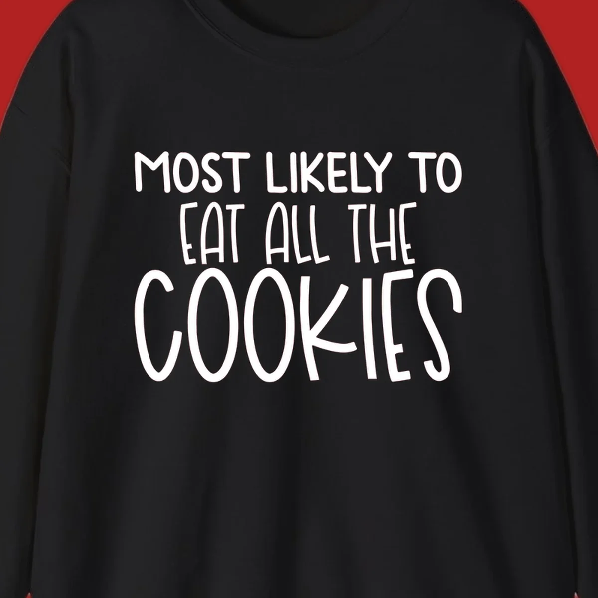 White text 'Most Likely To Eat All The Cookies' on a black background. typography