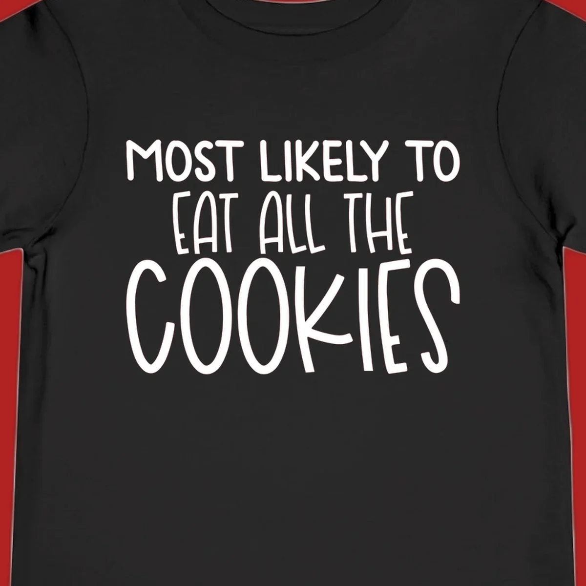 White text 'Most Likely To Eat All The Cookies' on a black background. typography