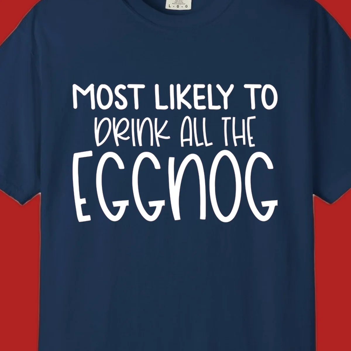 Text design 'Most Likely To Drink All The Eggnog' in white festive lettering for Christmas.