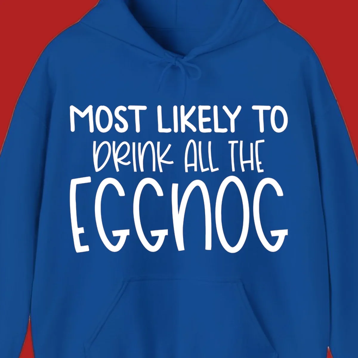 Text design 'Most Likely To Drink All The Eggnog' in white festive lettering for Christmas.
