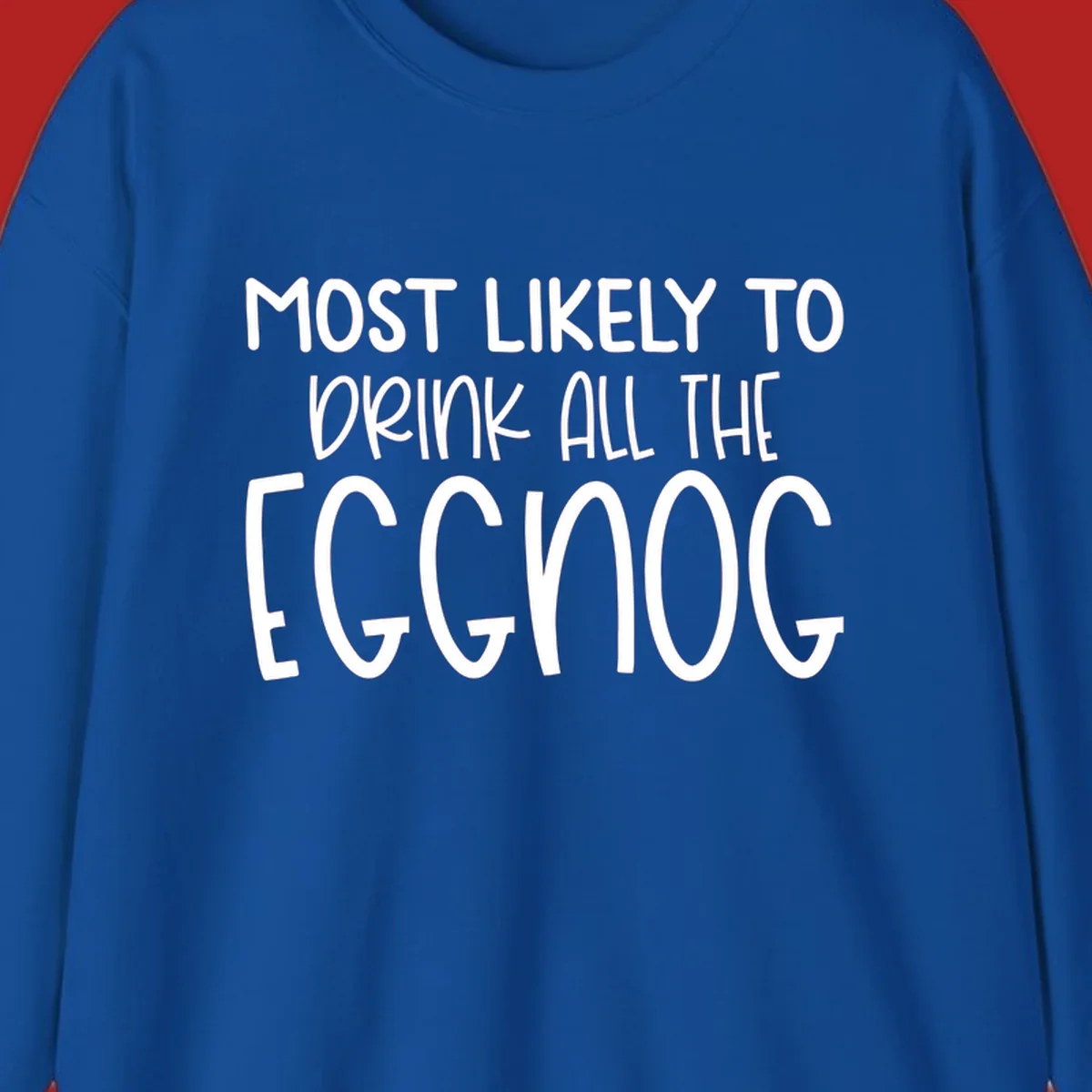 Text design 'Most Likely To Drink All The Eggnog' in white festive lettering for Christmas.