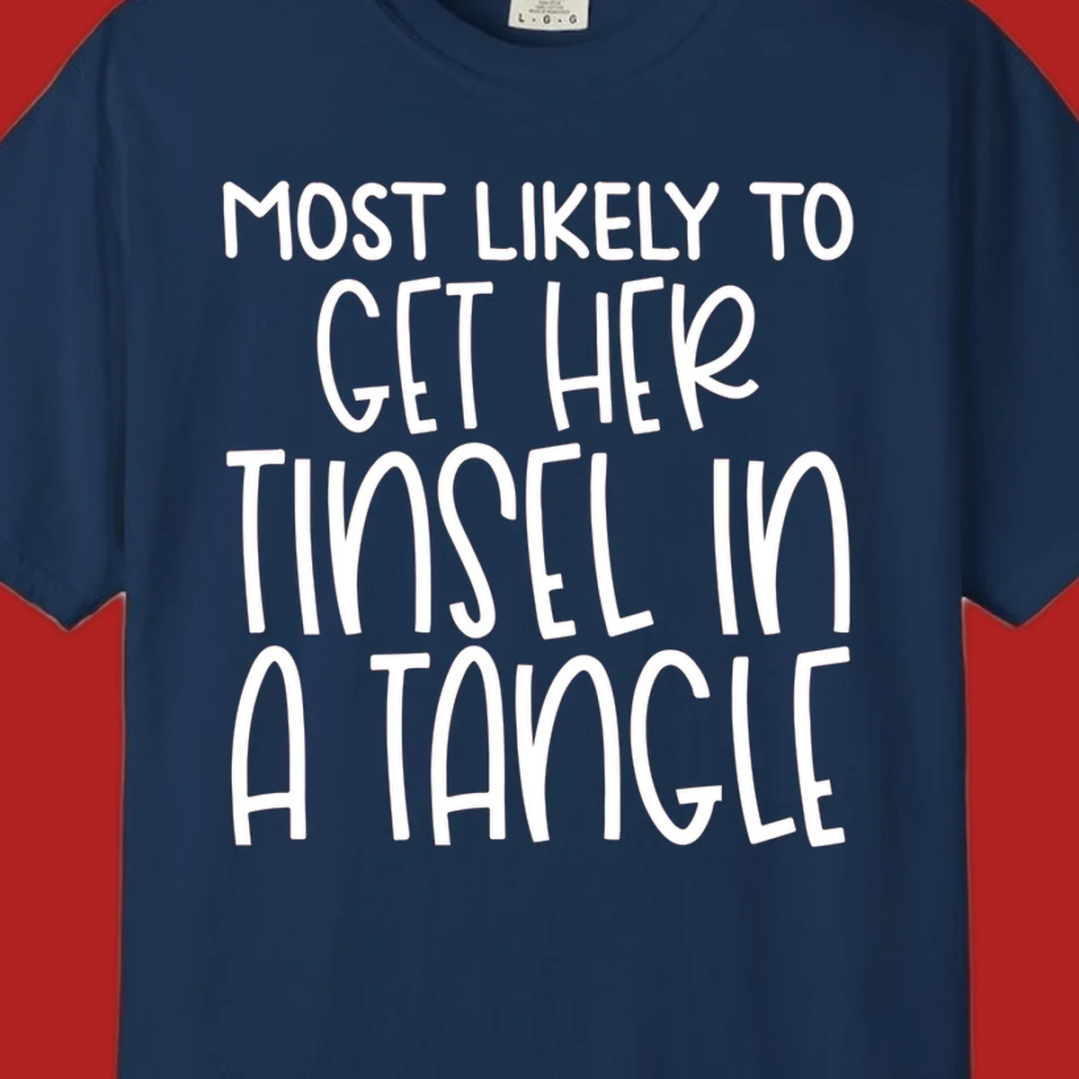 White text 'Most Likely To Get Her Tinsel In A Tangle' on a black background, holiday phrase.