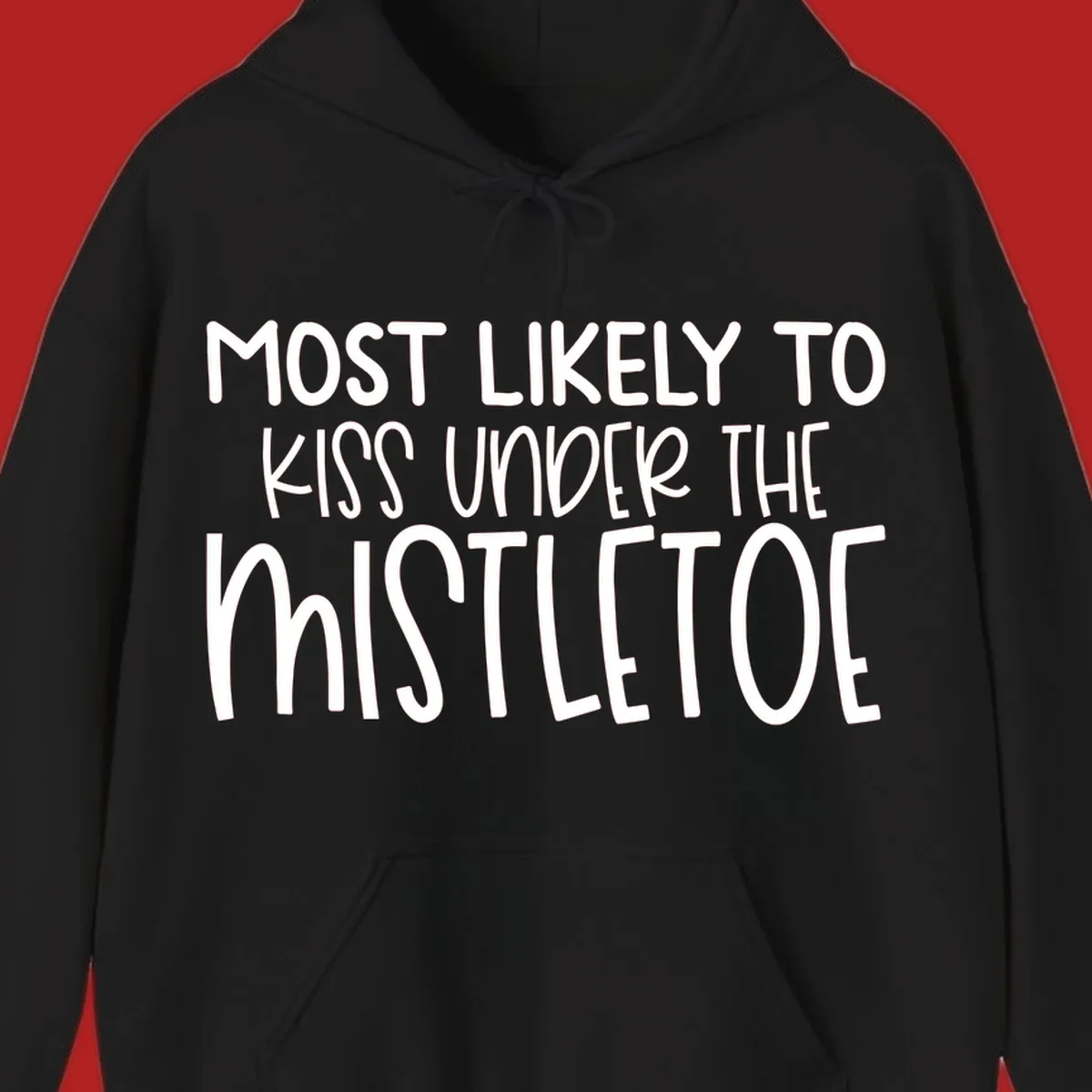 Typography design with the phrase 'Most Likely To Kiss Under Mistletoe' in white.