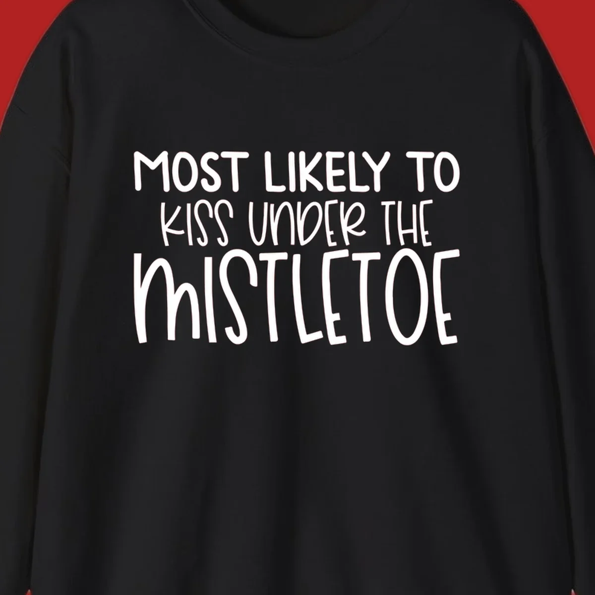 Typography design with the phrase 'Most Likely To Kiss Under Mistletoe' in white.