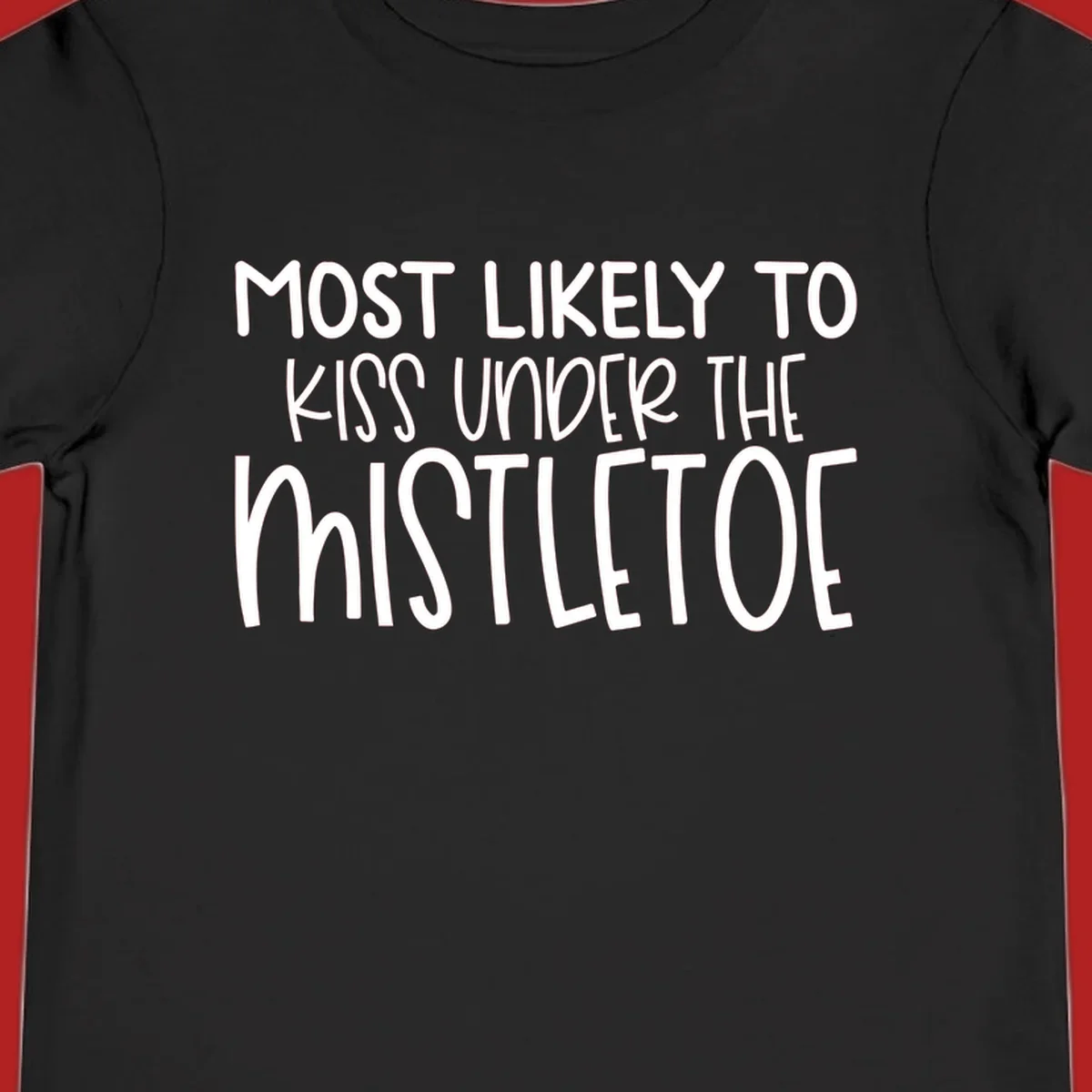 Typography design with the phrase 'Most Likely To Kiss Under Mistletoe' in white.