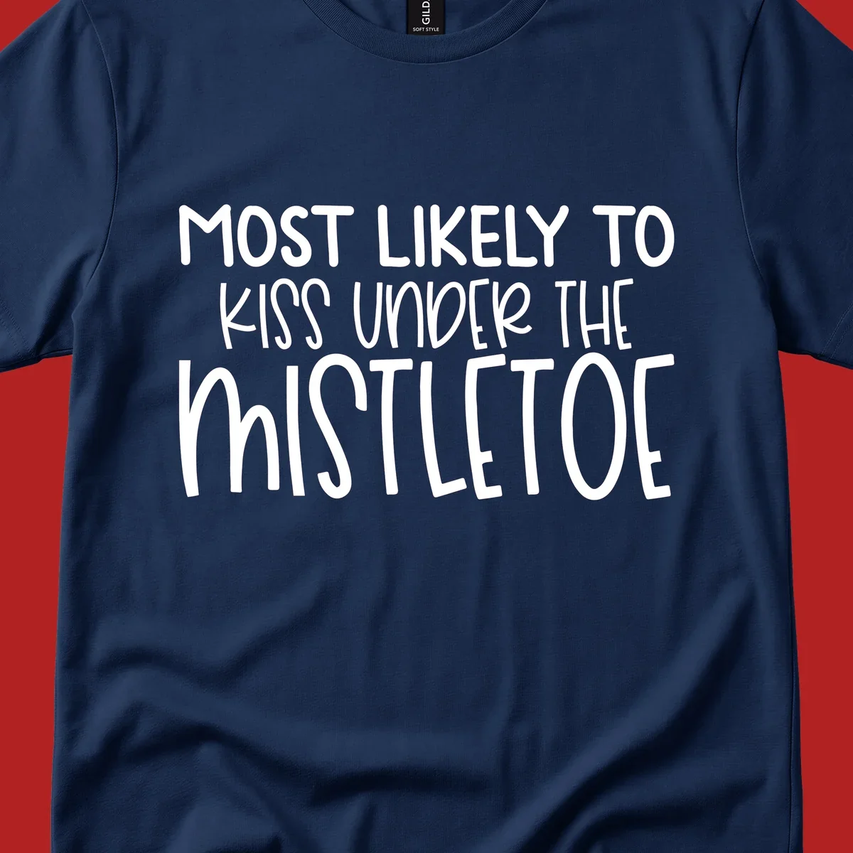 Typography design with the phrase 'Most Likely To Kiss Under Mistletoe' in white.