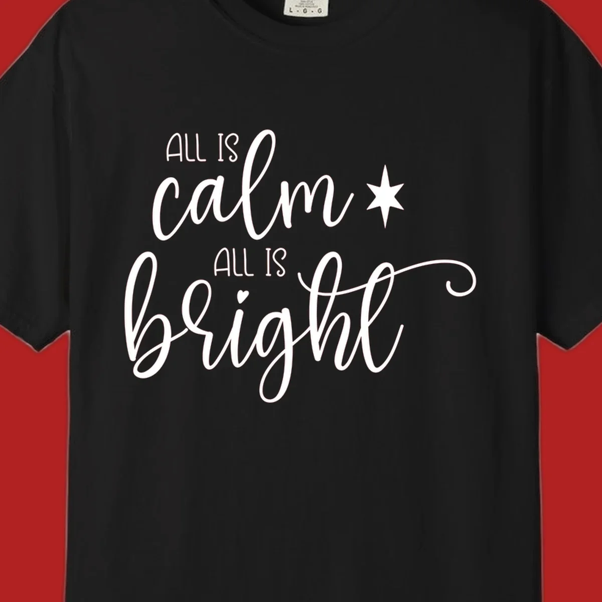 Elegant white script text 'All Is Calm All Is Bright' with star and heart, holiday design.