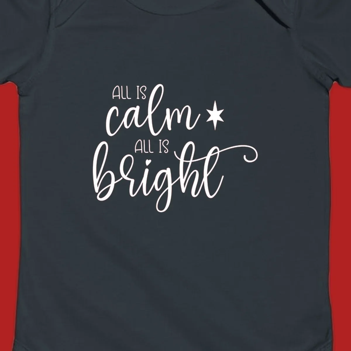 Elegant white script text 'All Is Calm All Is Bright' with star and heart, holiday design.