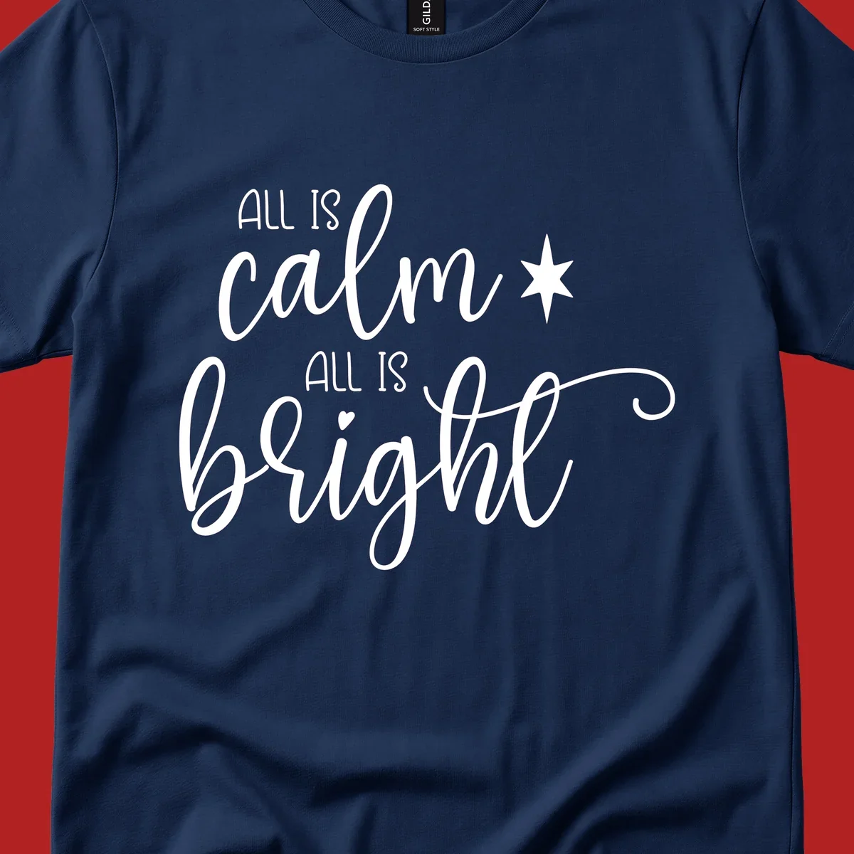 Elegant white script text 'All Is Calm All Is Bright' with star and heart, holiday design.