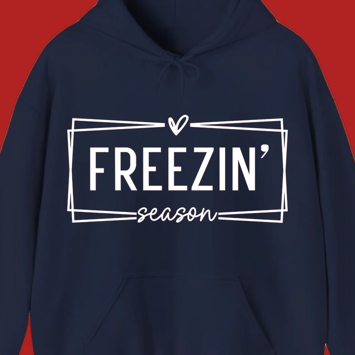 Freezin' Season text design with heart icon and border, for winter holidays.