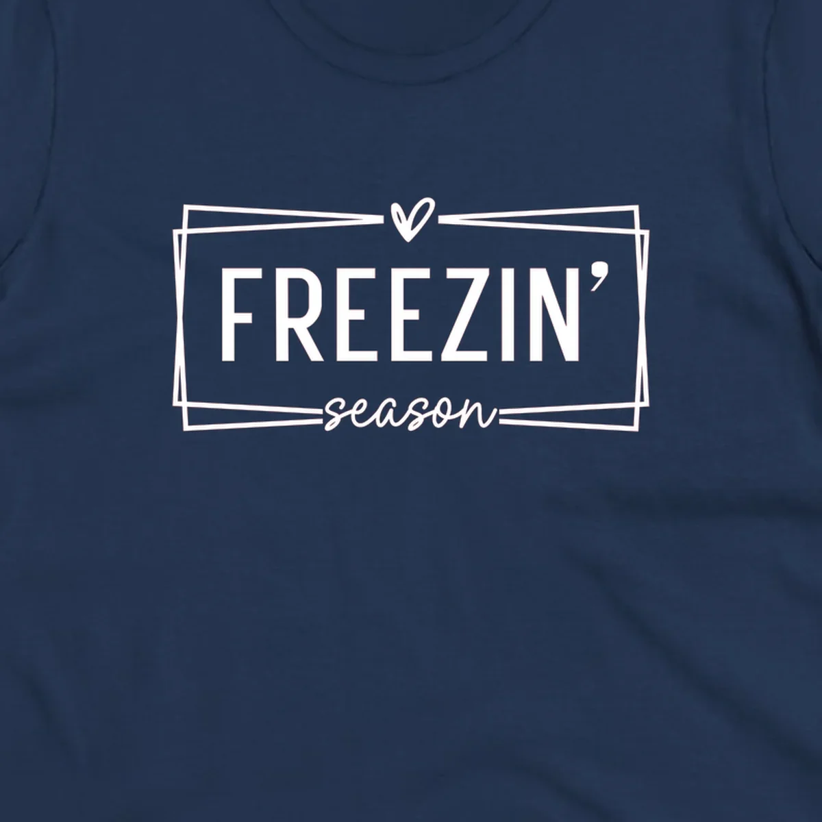 Freezin' Season text design with heart icon and border, for winter holidays.