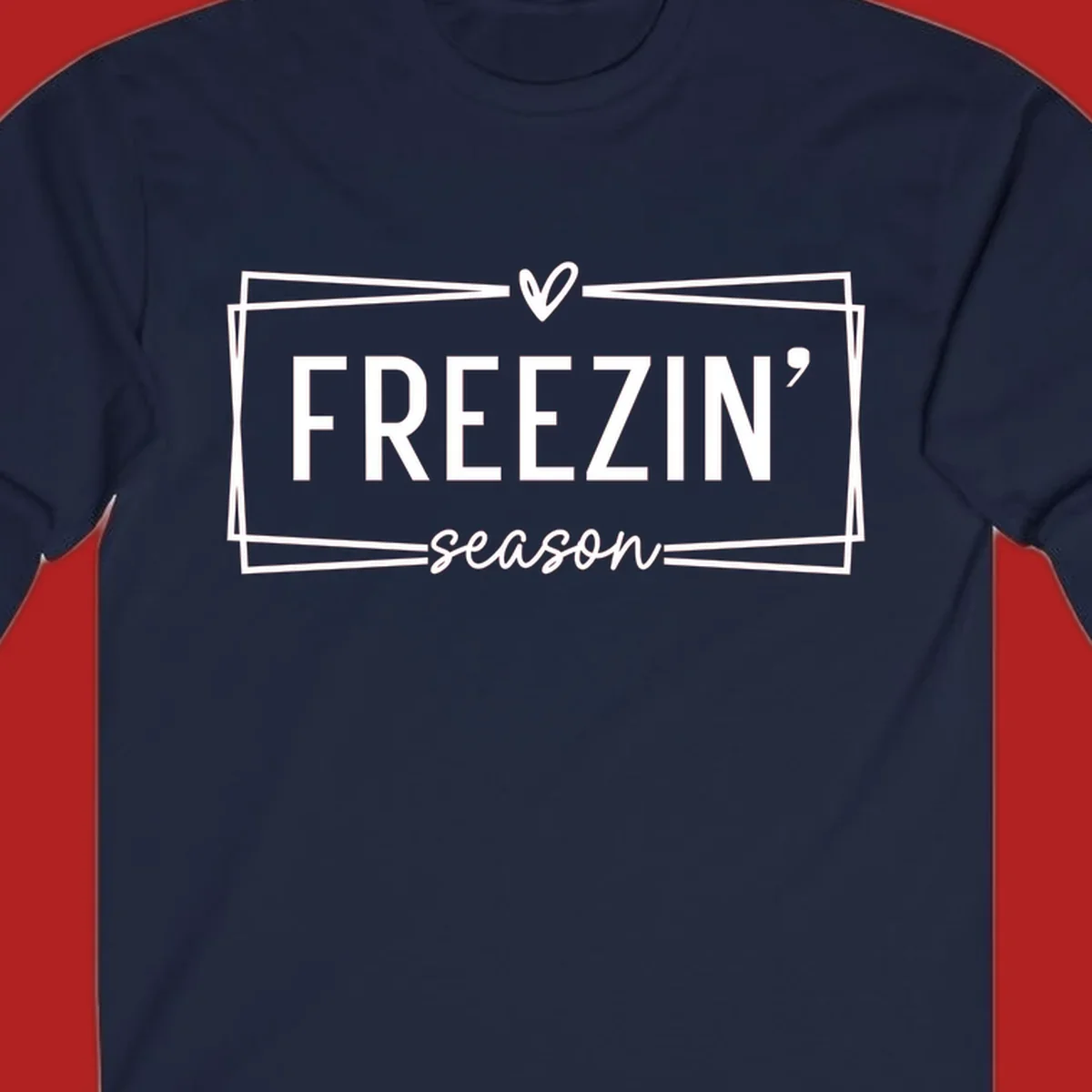 Freezin' Season text design with heart icon and border, for winter holidays.