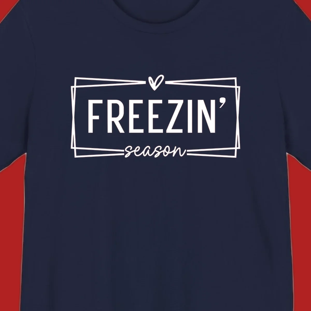 Freezin' Season text design with heart icon and border, for winter holidays.
