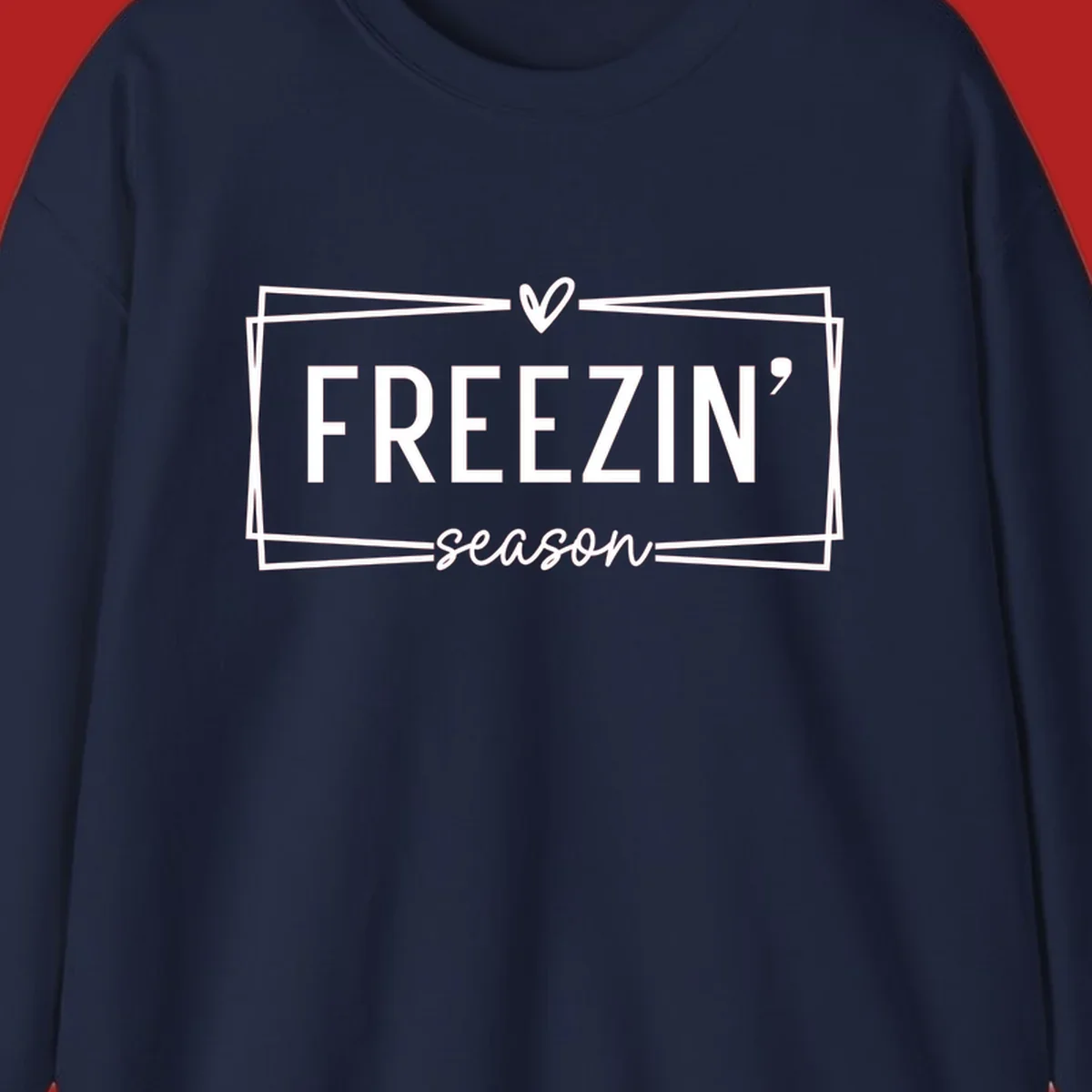 Freezin' Season text design with heart icon and border, for winter holidays.