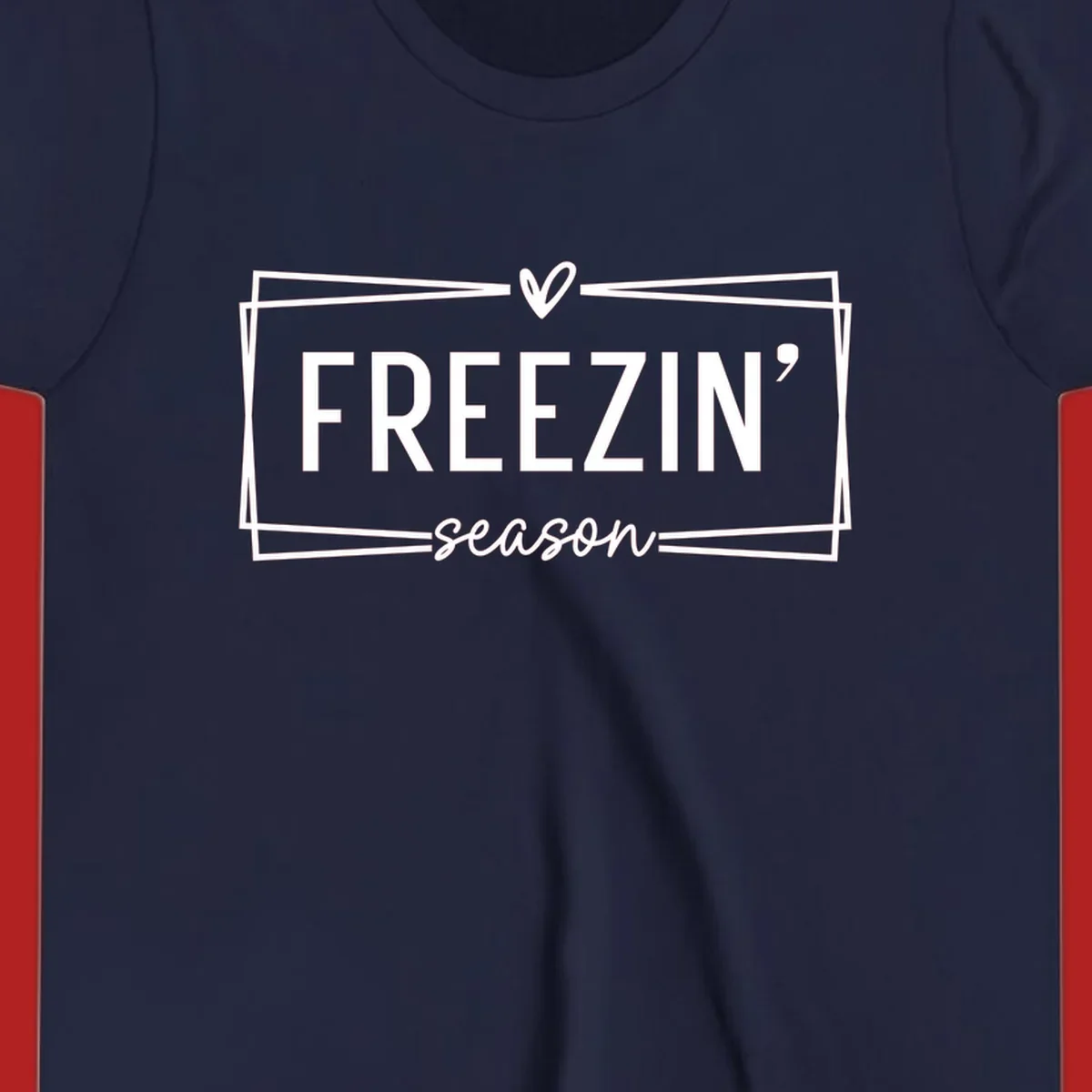 Freezin' Season text design with heart icon and border, for winter holidays.