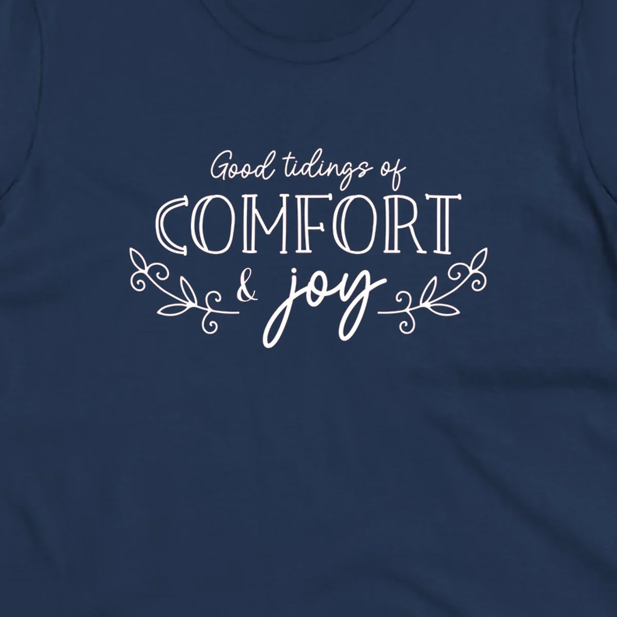 Good tidings of comfort and joy holiday text design with floral accents.