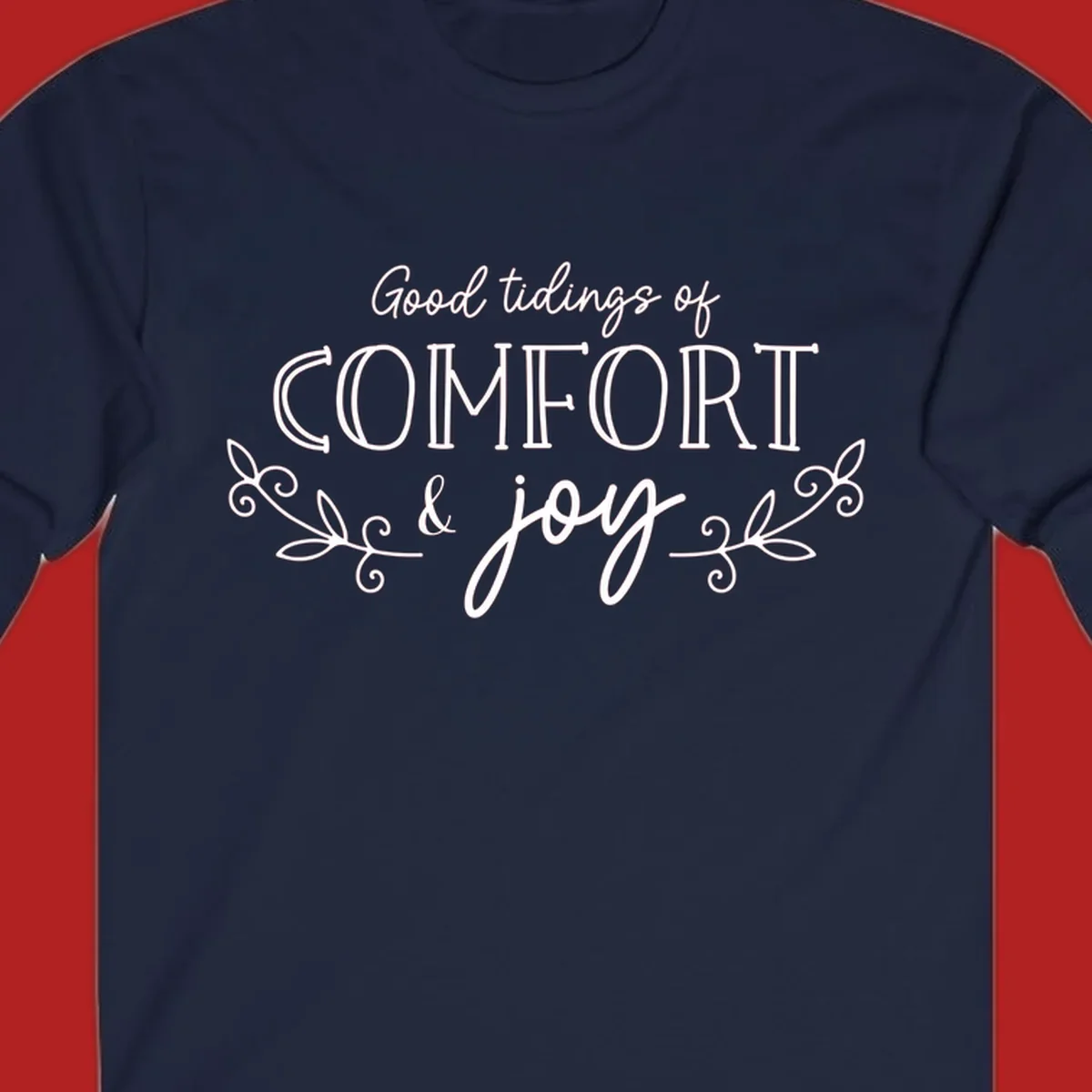 Good tidings of comfort and joy holiday text design with floral accents.