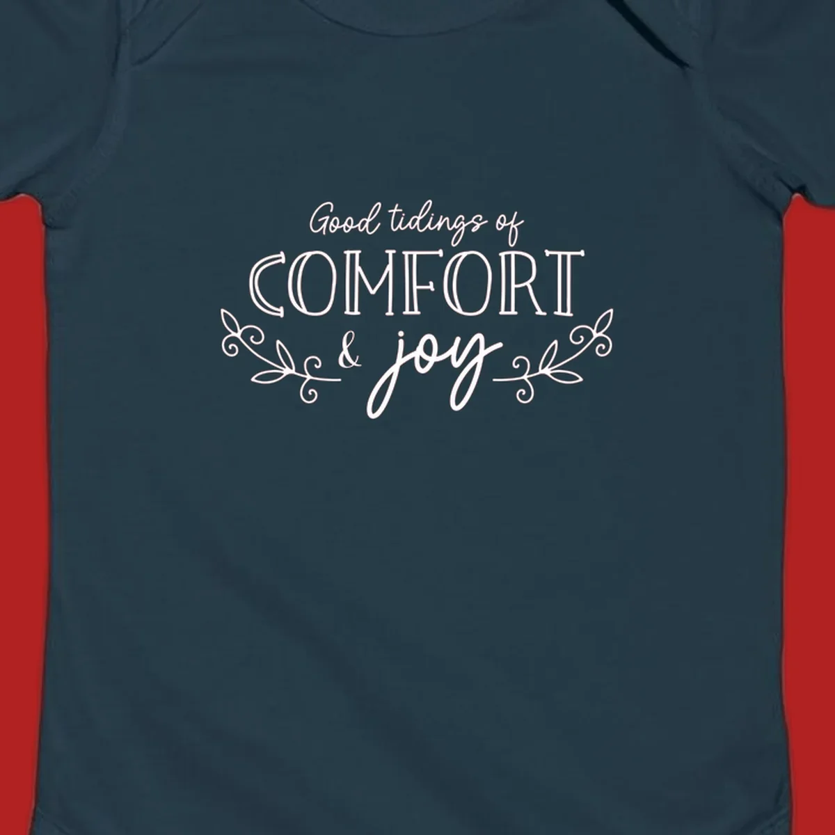 Good tidings of comfort and joy holiday text design with floral accents.