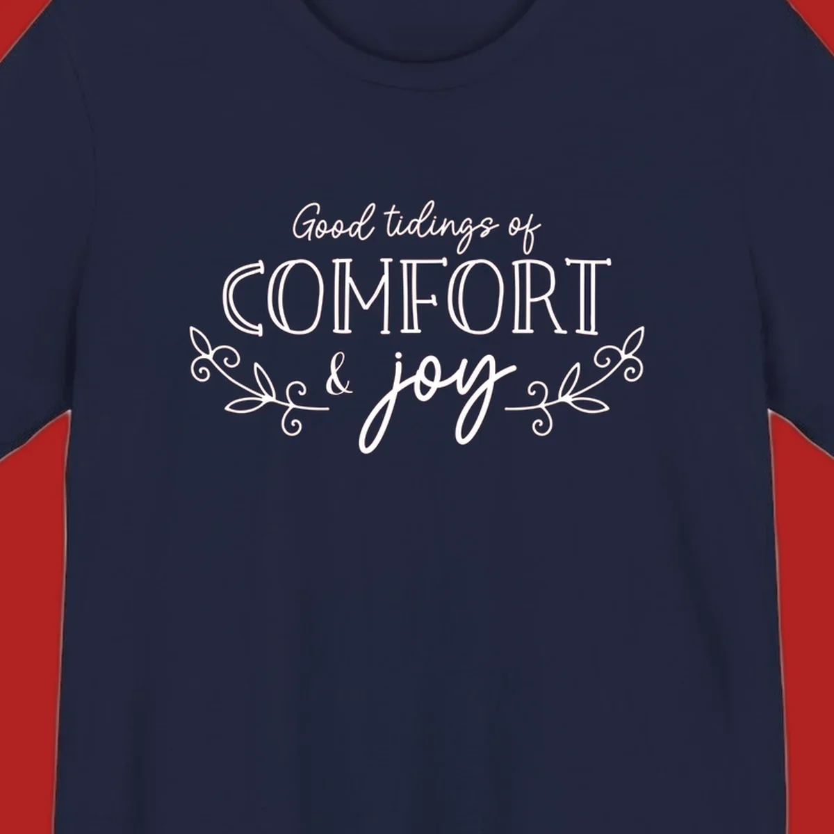Good tidings of comfort and joy holiday text design with floral accents.