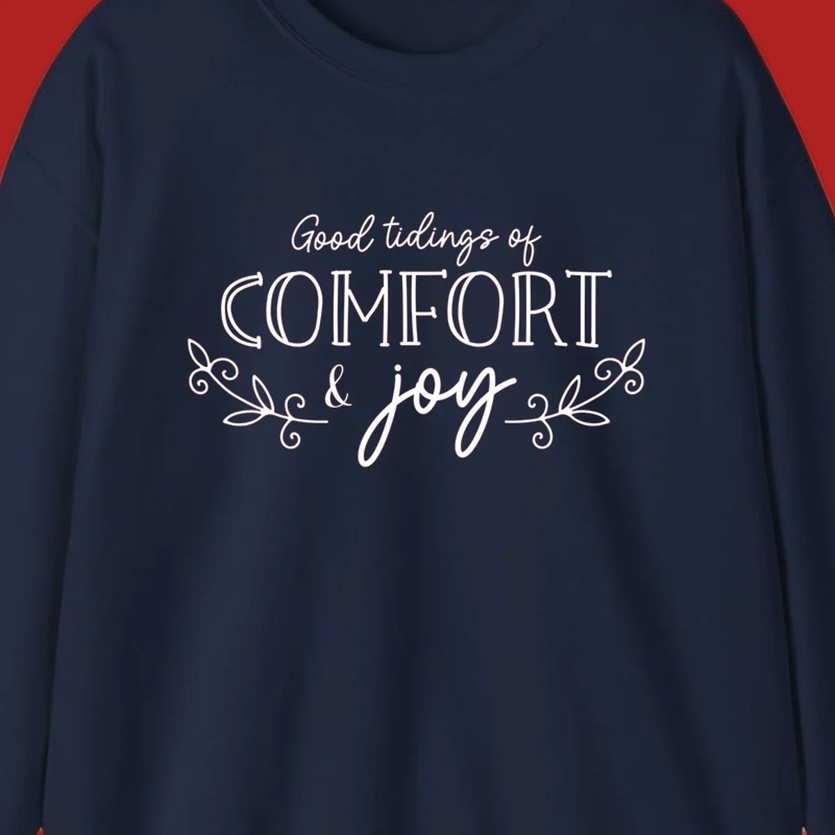 Good tidings of comfort and joy holiday text design with floral accents.