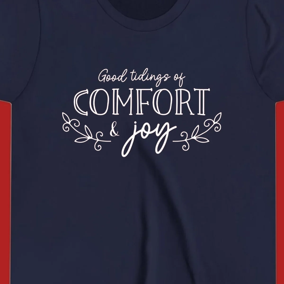 Good tidings of comfort and joy holiday text design with floral accents.