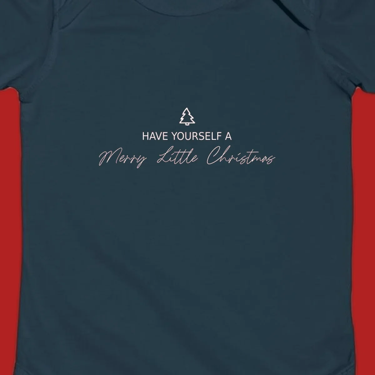 Typography design with a Christmas tree and the phrase 'Have Yourself A Merry Little Christmas' in script and block letters.