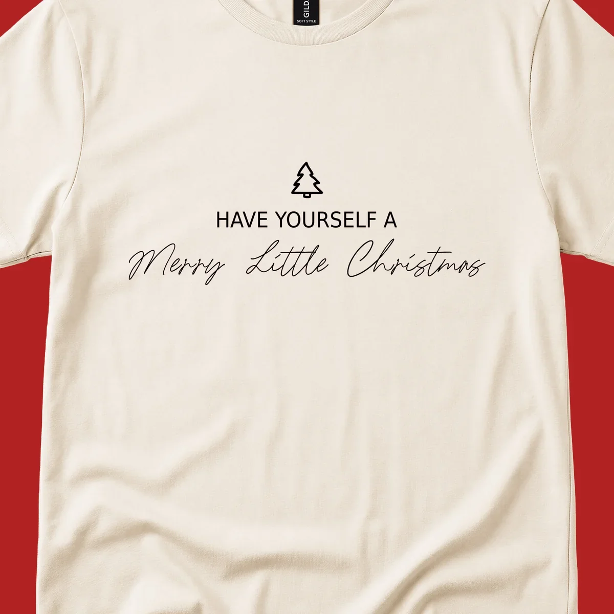 Typography design with a Christmas tree and the phrase 'Have Yourself A Merry Little Christmas' in script and block letters.