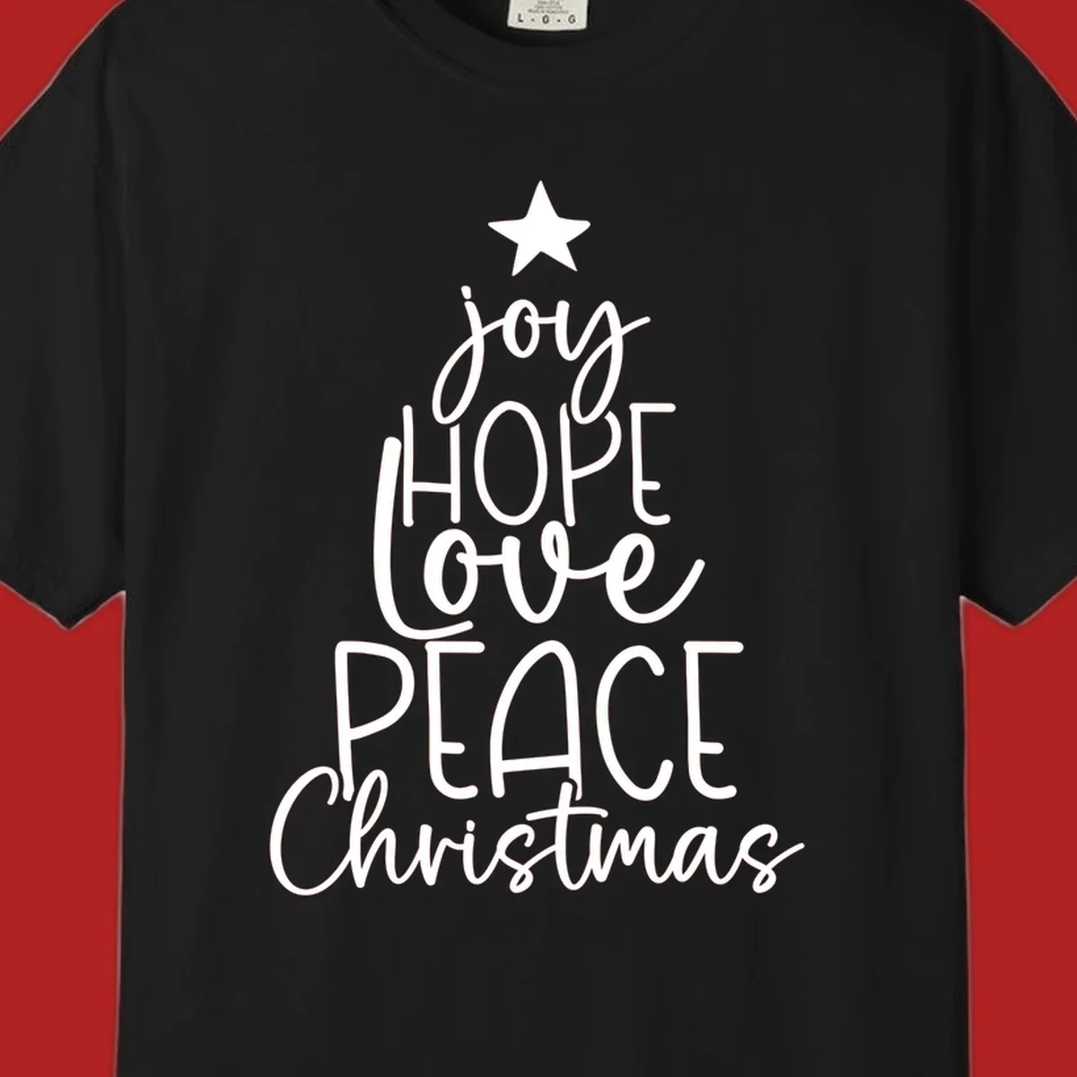 Christmas tree made of words joy, hope, love, peace, and Christmas with a star on top.