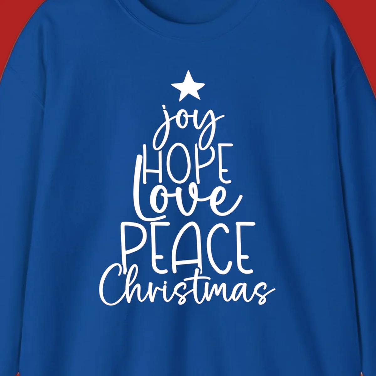Christmas tree made of words joy, hope, love, peace, and Christmas with a star on top.