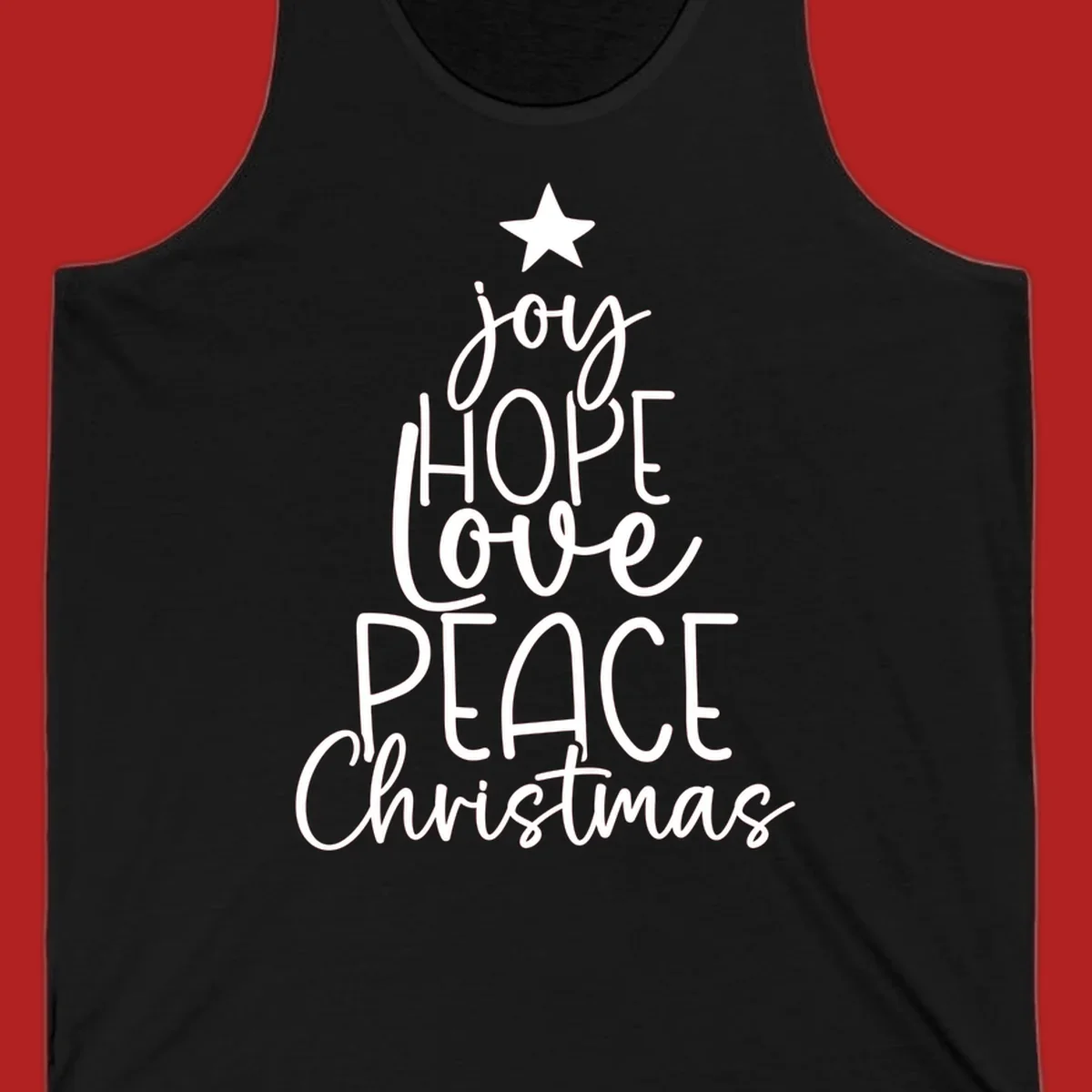 Christmas tree made of words joy, hope, love, peace, and Christmas with a star on top.