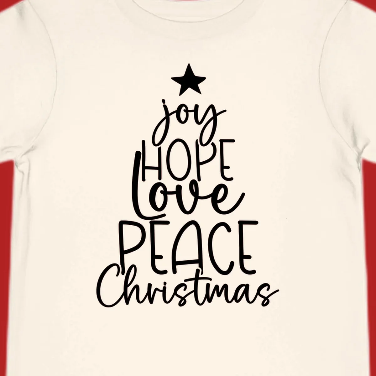 Christmas tree made of words joy, hope, love, peace, and Christmas with a star on top.