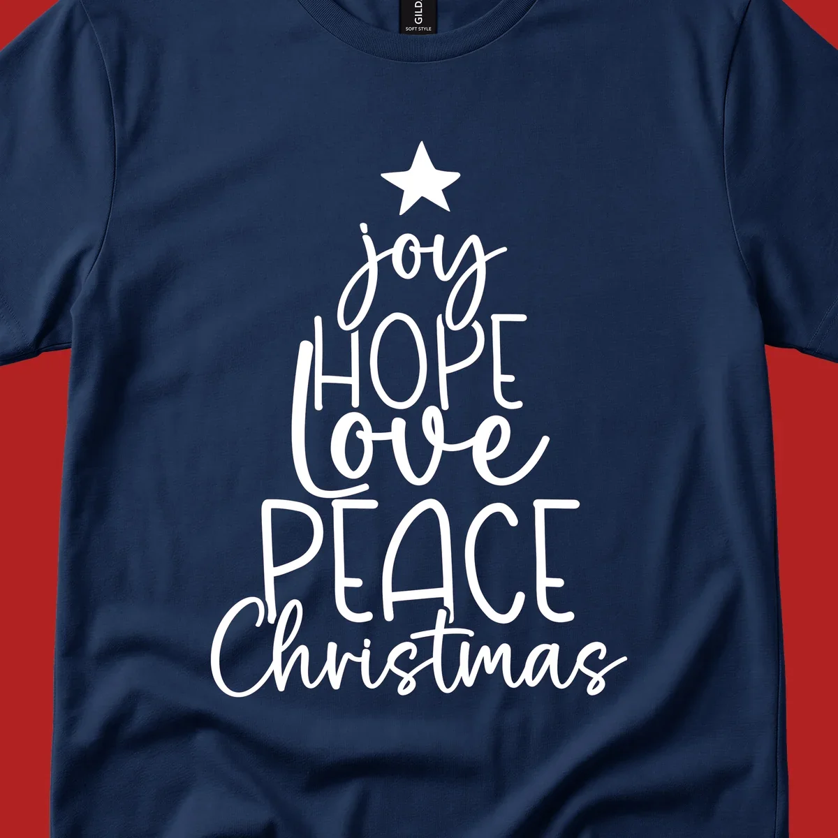 Christmas tree made of words joy, hope, love, peace, and Christmas with a star on top.