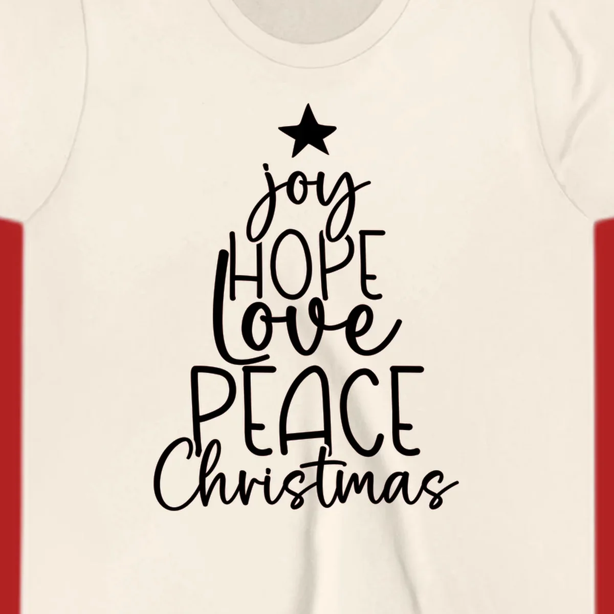 Christmas tree made of words joy, hope, love, peace, and Christmas with a star on top.