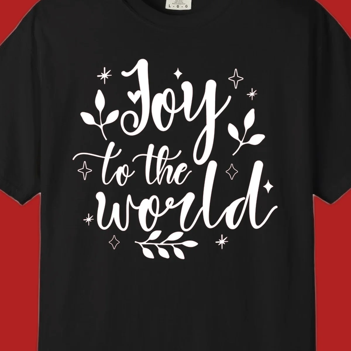Joy to the world Christmas lettering with stars and leaves.