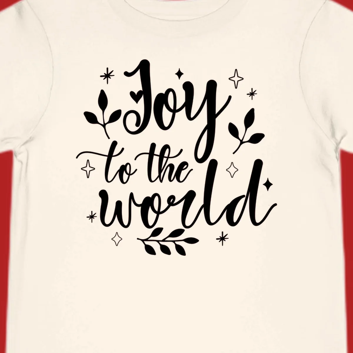 Joy to the world Christmas lettering with stars and leaves.