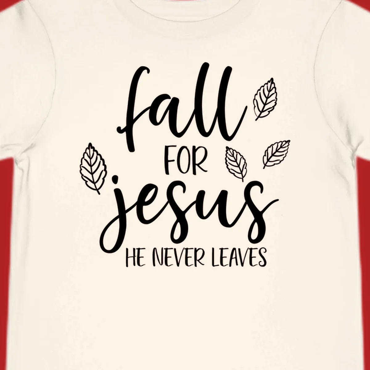 Fall for Jesus He Never Leaves text with autumn leaves design