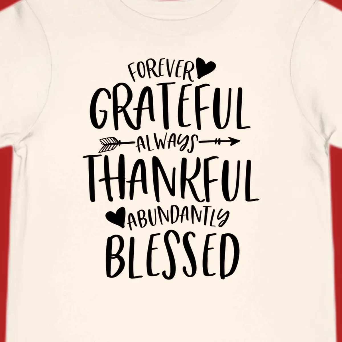 Grateful thankful blessed lettering with heart and arrow graphic