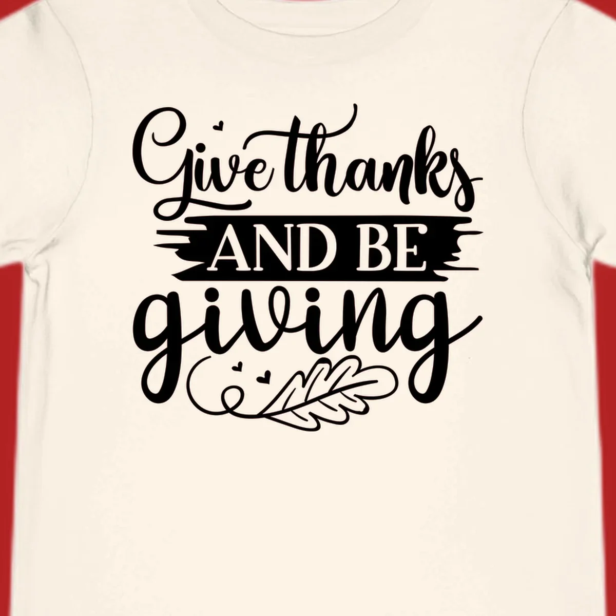 Give thanks and be giving Thanksgiving text with leaf illustration.