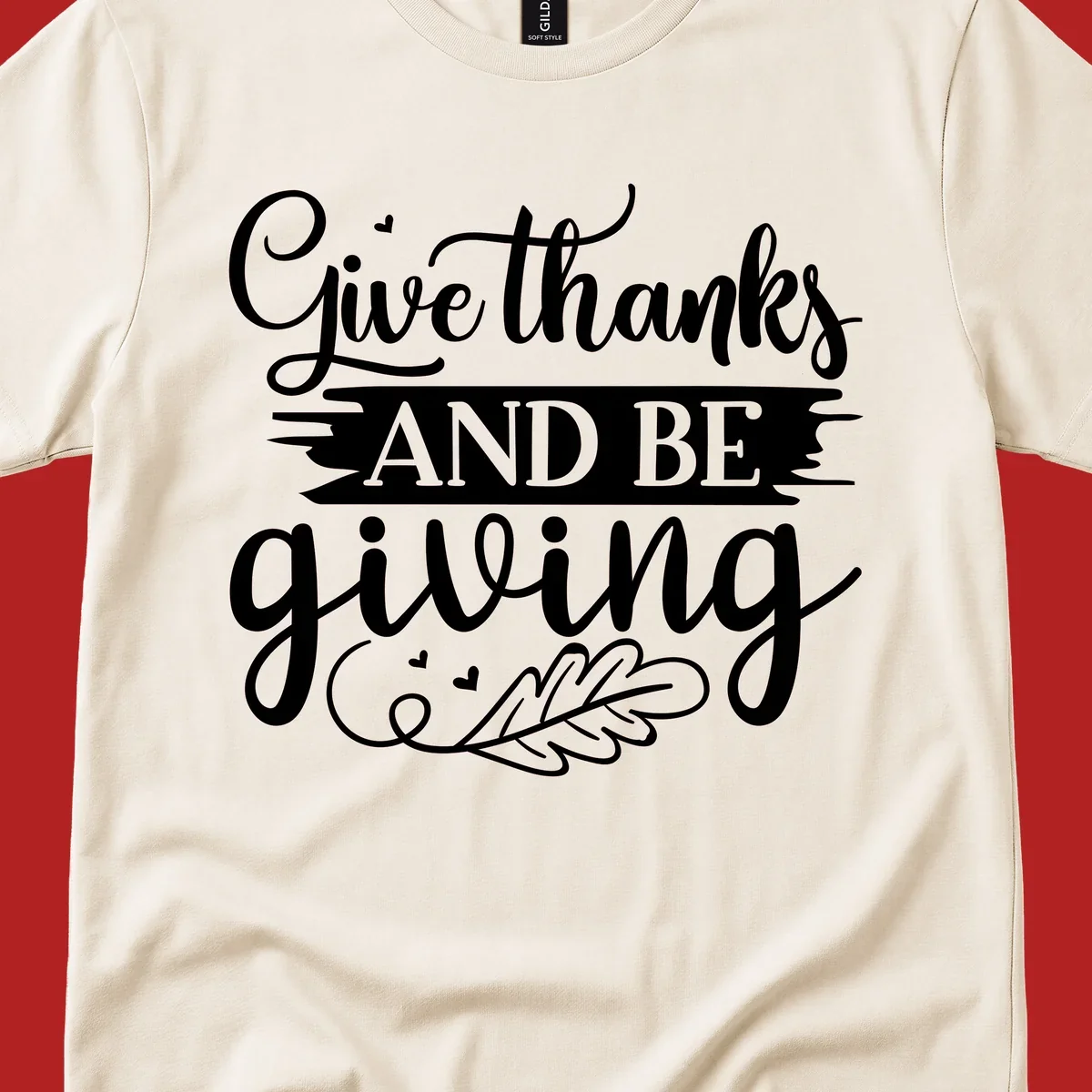 Give thanks and be giving Thanksgiving text with leaf illustration.