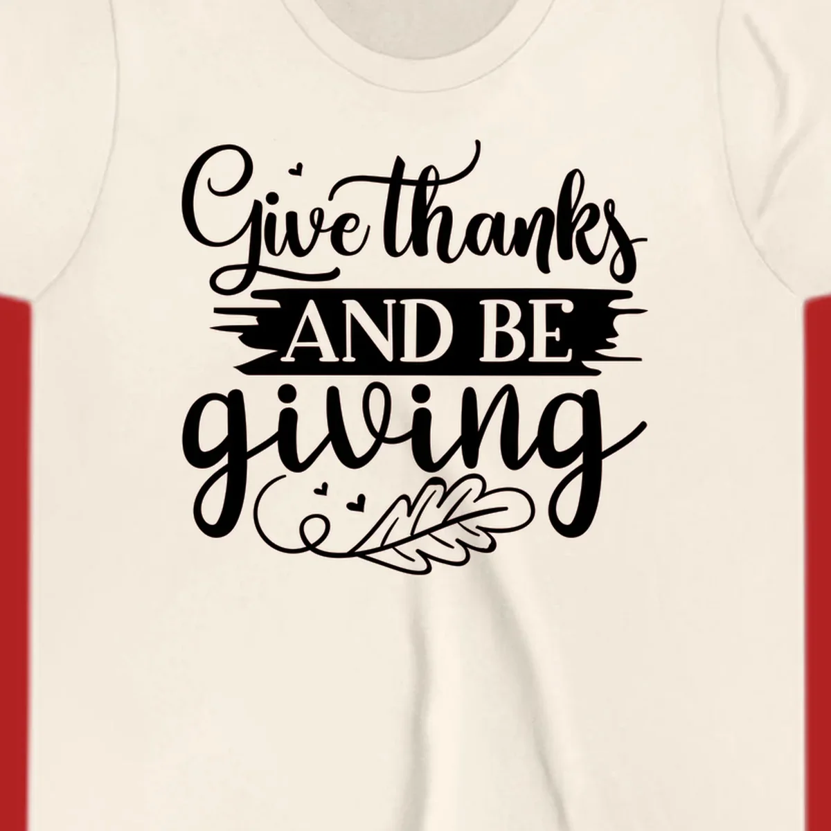 Give thanks and be giving Thanksgiving text with leaf illustration.