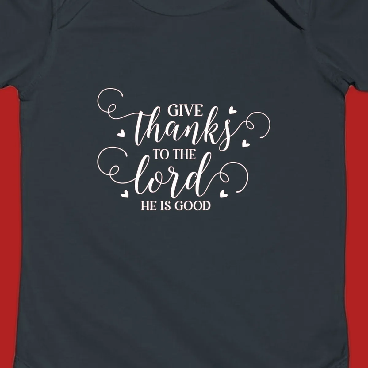 Give Thanks To The Lord Christian Typography design with white lettering and decorative hearts.