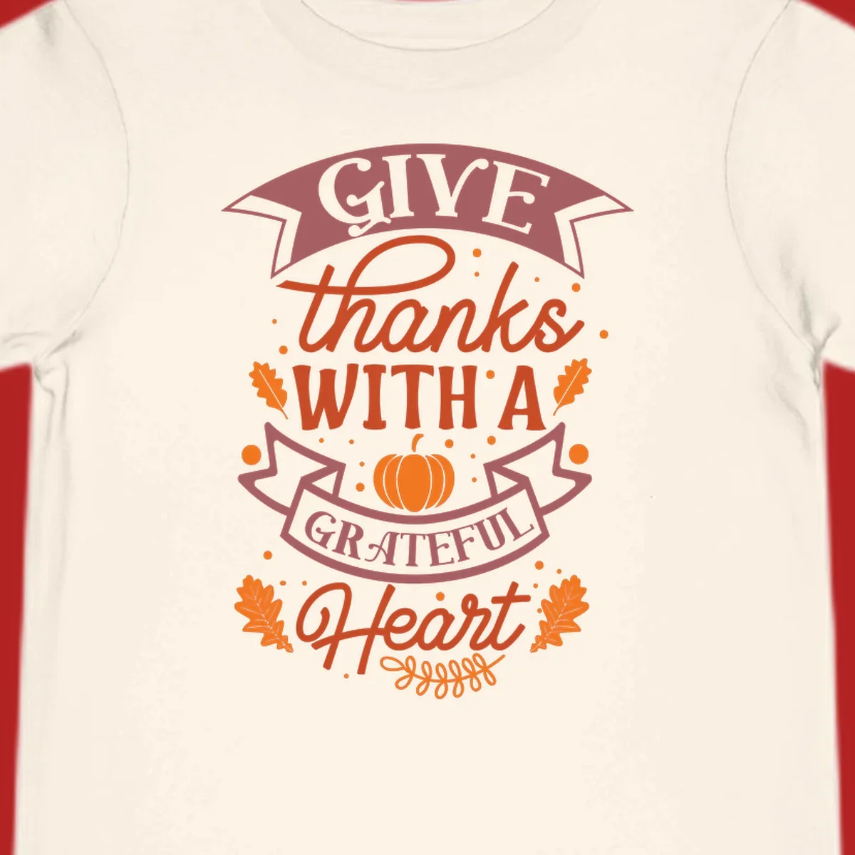 Grateful Heart Thanksgiving design with text, pumpkin, and leaves.