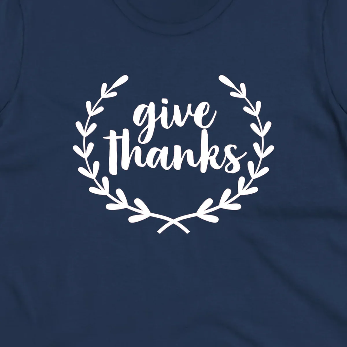 Give thanks script text inside a laurel wreath.