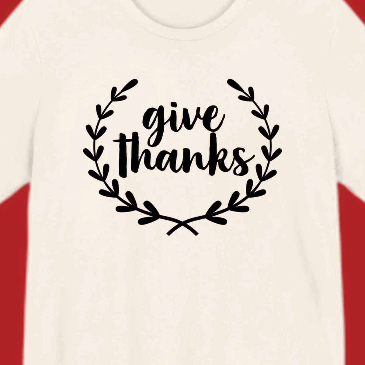 Give thanks script text inside a laurel wreath.